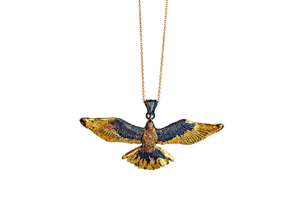 Gold Accented Flying Bird Pendant